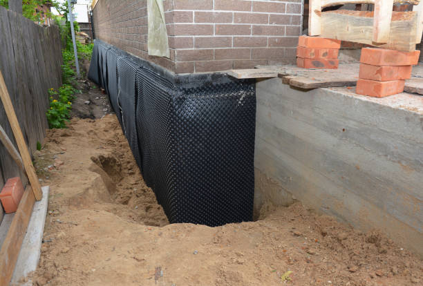 SJ Waterproofing Pros technician performing targeted Interior Drainage System assessment in Douglas, AL